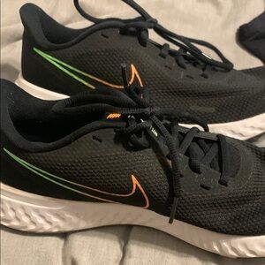 Nike Black Shoes with Orange and Green Details